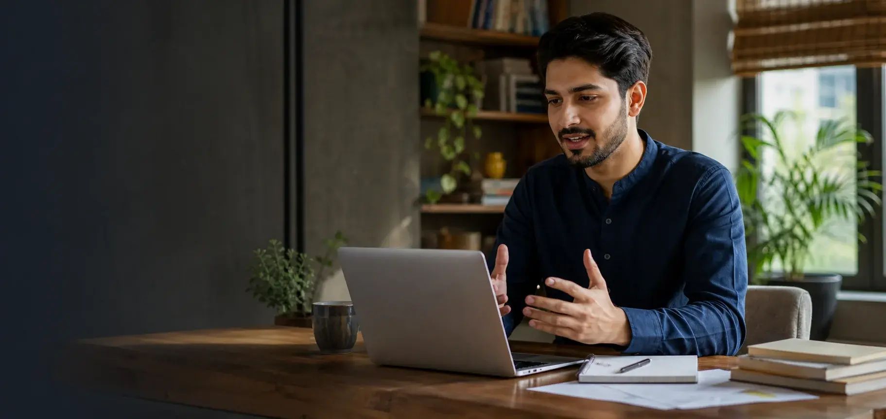 Pakistani freelancer confidently presenting to a client on a video call