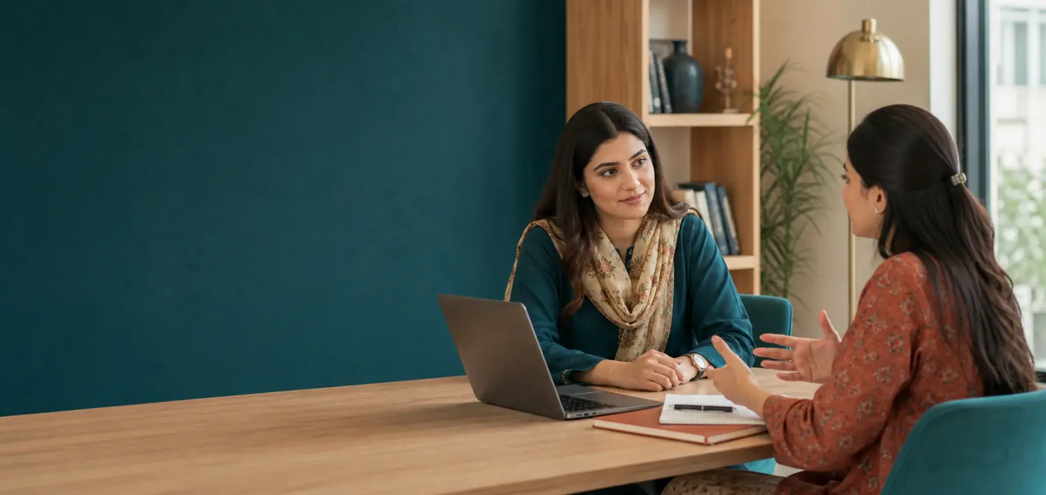 Pakistani learner discussing her language goals with a course advisor